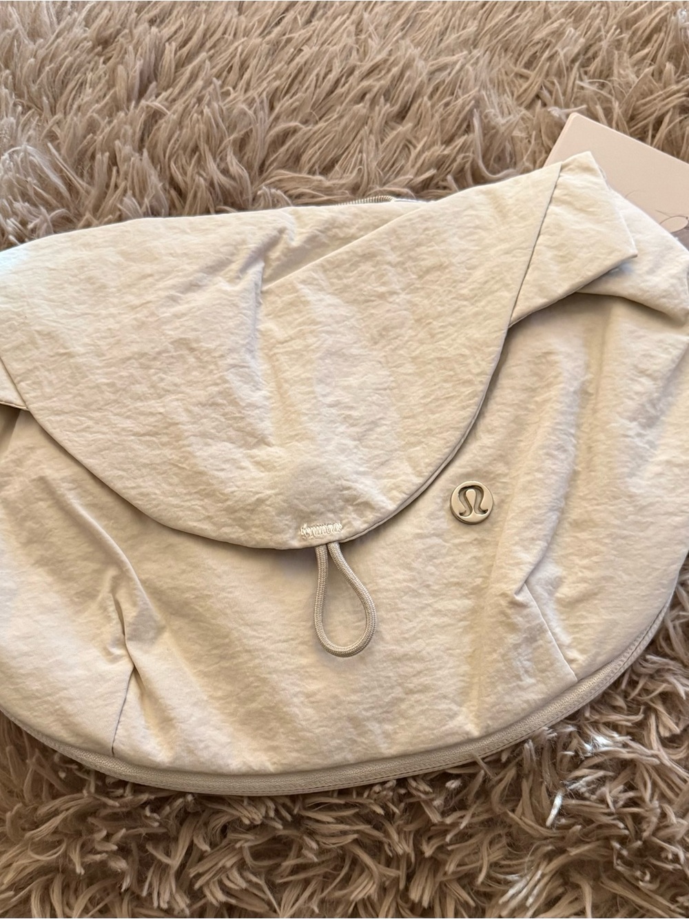 Lululemon athletica Light Beige Curved Crossbody Bottle Bag